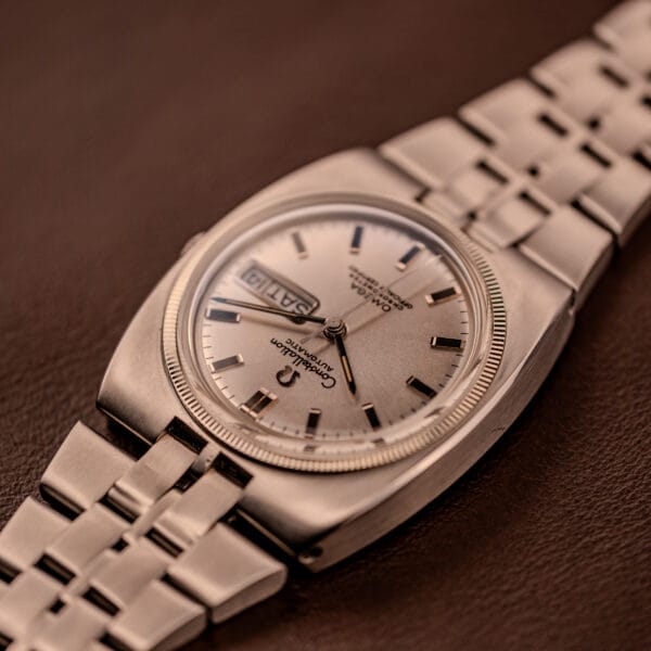 Omega Constellation 168.045 36mm cushion case at oblique angle with day-date aperture at three