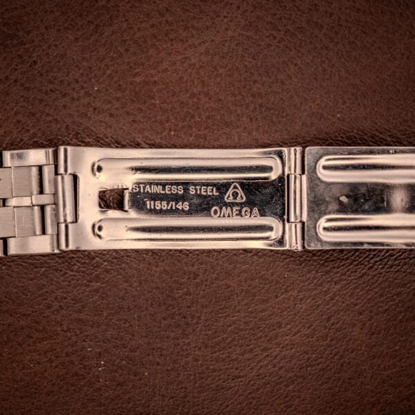 Omega 1155/146 integrated bracelet clasp underside stamped STAINLESS STEEL with Omega triangle hallmark