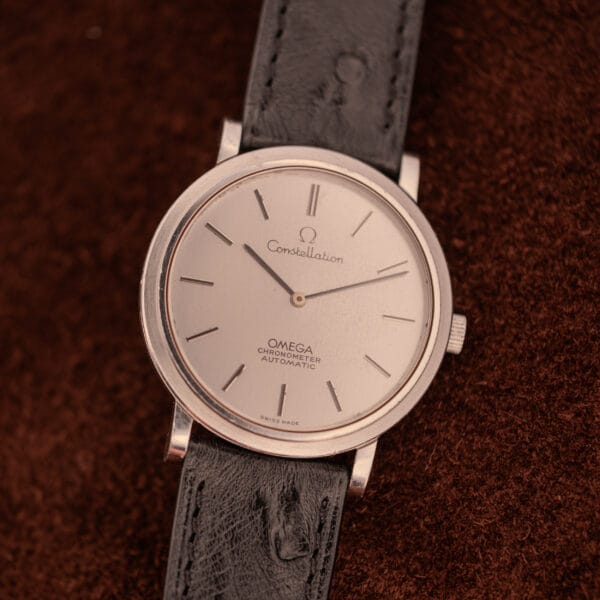 Omega Constellation 157.0001 ultra-thin steel case three-quarter view on black ostrich leather strap