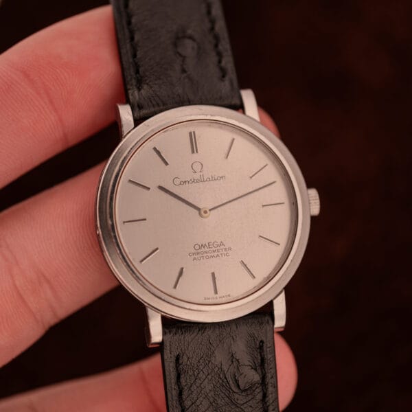 Omega Constellation Ultra Thin Ref. 157.0001 in hand showing 34.4mm slim dress case scale
