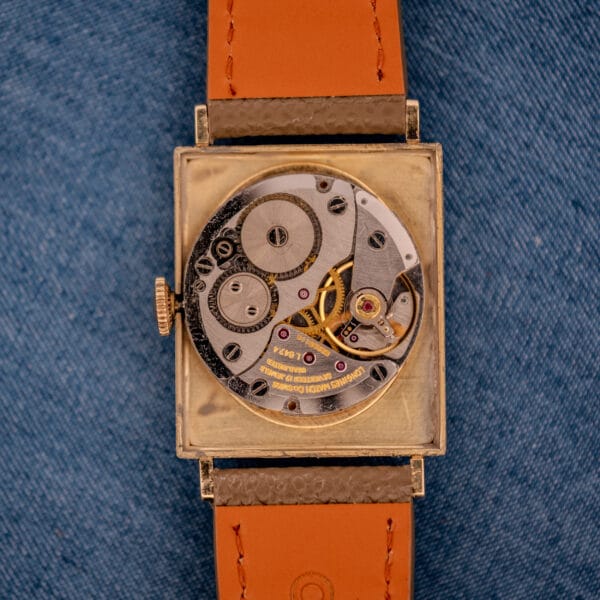 Longines caliber L647.4 manual-wind movement with rhodium-finished bridges and seventeen-jewel layout inside the open Tank 3217-428 case