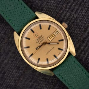 Omega Electronic F-300 Hz Chronometer ref. 1980045 with sunburst champagne day-date dial on a pine green saffiano leather strap