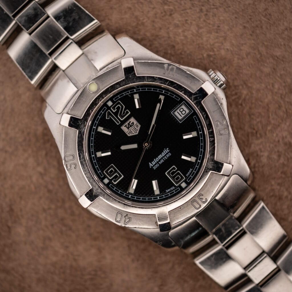 TAG Heuer 2000 Series WN2111 black waffle dial with applied shield logo and uni-directional 200m bezel