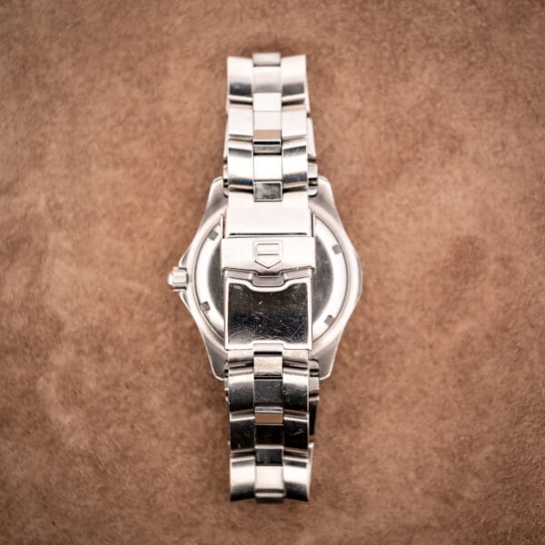 TAG Heuer WN2111 caseback view through bracelet with integrated curved endlinks