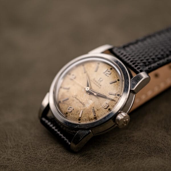 Omega Seamaster 2828 stainless steel cushion case three-quarter studio shot