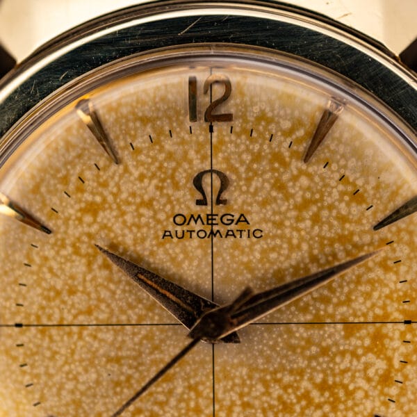 Omega Seamaster 14363-3 tropical dial macro showing Omega Automatic logo, 12 numeral, and crosshair