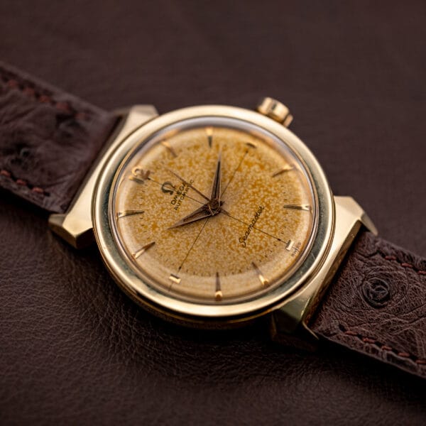 Omega Seamaster Ref. 14363-3 angled dial view with Omega-signed crown and faceted scarab lugs