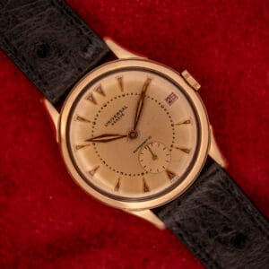 Universal Geneve Automatic Bumper 138C factory champagne sunburst dial overhead view