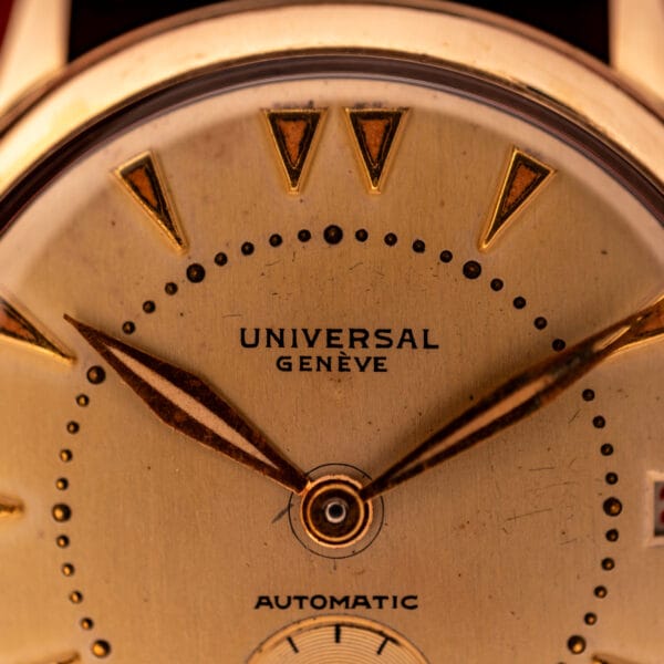 Universal Geneve 138C dial macro showing applied dart markers and printed UNIVERSAL GENEVE wordmark