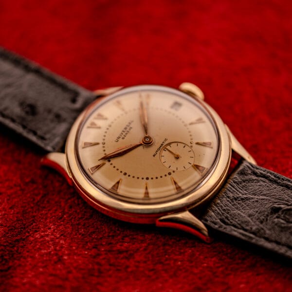 Universal Geneve Bumper 138C tear-drop lugs three-quarter view on black ostrich strap