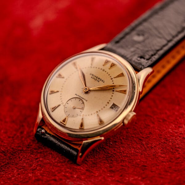 Universal Geneve Automatic Bumper 138C front three-quarter view on black ostrich leather strap
