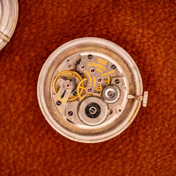 LeCoultre 450/CW movement front view showing balance wheel, mainspring barrel and rhodium-finished bridges