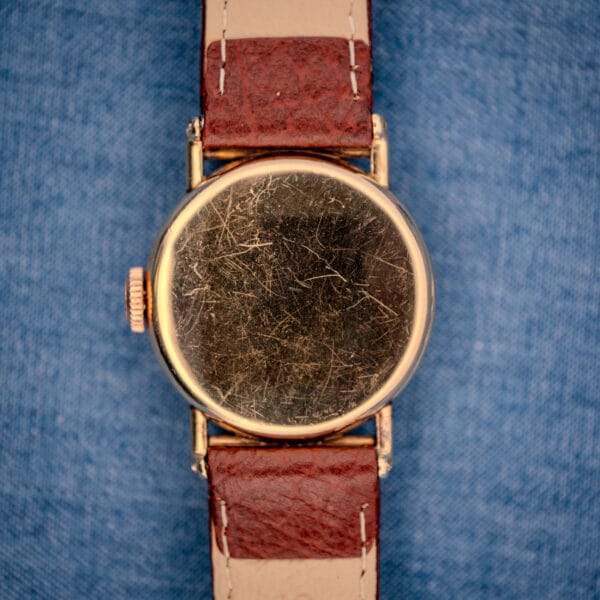 1936 Hamilton Randolph outer caseback in 10k yellow gold filled showing honest hairline wear across eight decades on the wrist
