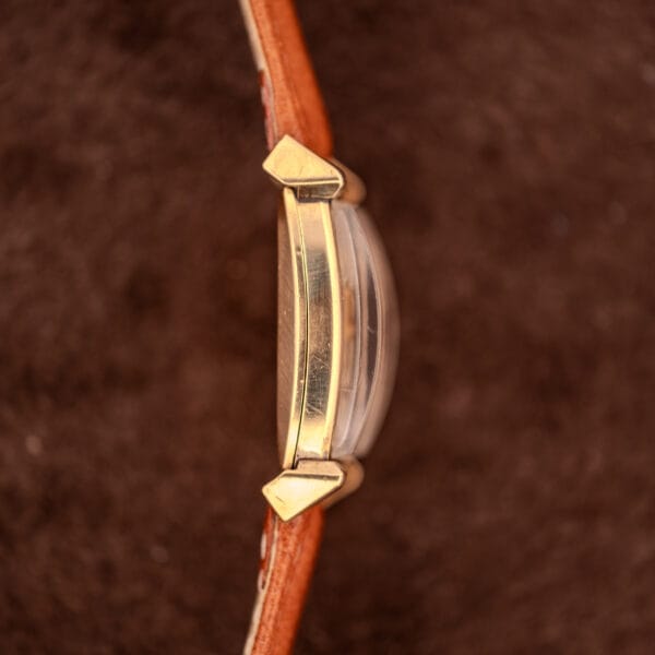 Gruen Precision tank case side profile showing scrolled lugs and 10k gold filled finish