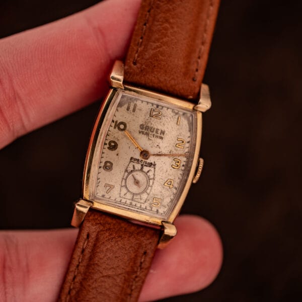 Vintage Gruen Precision Ref. 430-457 tank watch held in hand showing 22.3mm case on the wrist