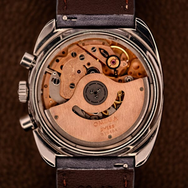 Omega caliber 1040 column-wheel automatic chronograph movement with copper-toned rotor signed OMEGA SWISS R 15484