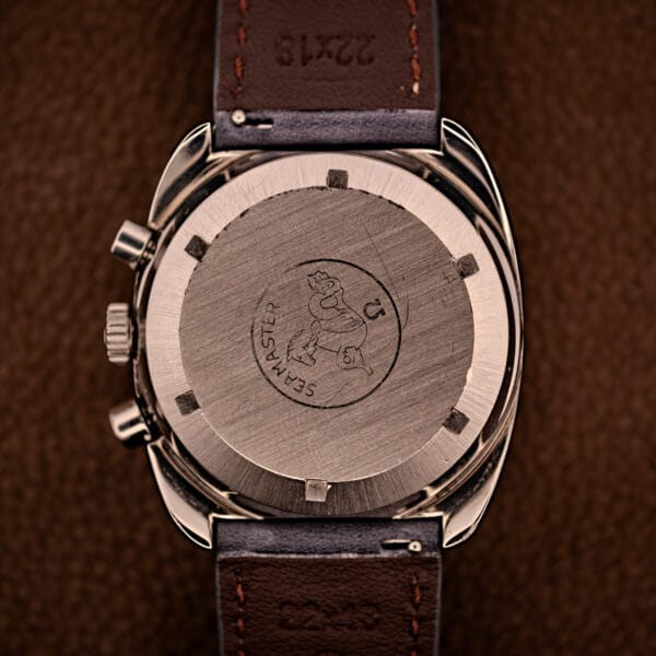 Omega 176.007 screw-down caseback engraved with the Seamaster Hippocampus seahorse emblem on brown leather