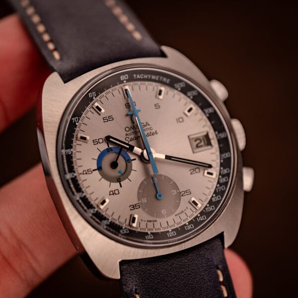 Omega 176.007 Blue Jedi held in hand showing factory dial, black pencil hands and sky-blue chronograph minute hand