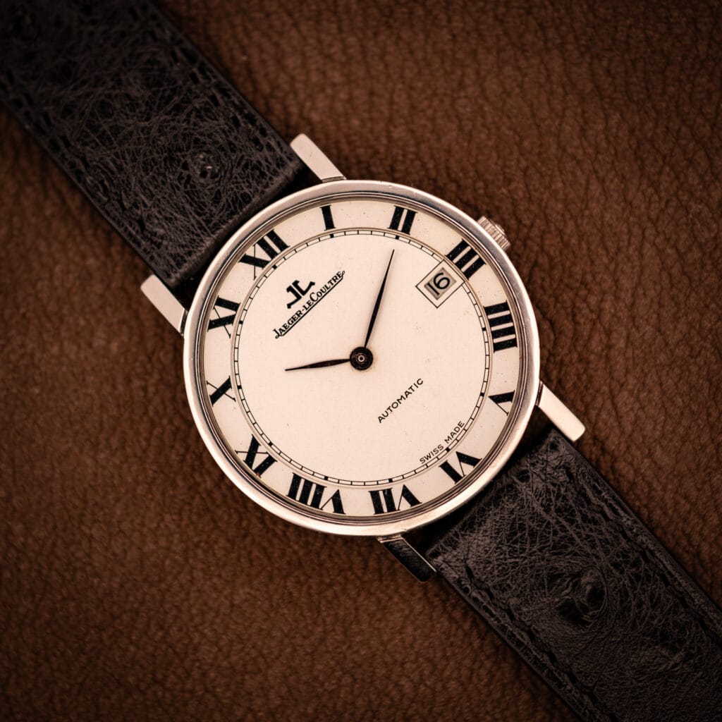 Jaeger LeCoultre Ultra Thin Ref. 5003.42 steel automatic, factory white Roman numeral dial, black ostrich strap, top-down hero shot.