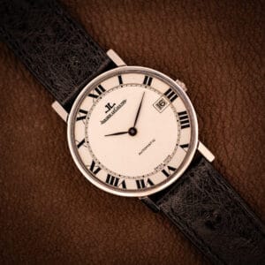 Jaeger LeCoultre Ultra Thin Ref. 5003.42 steel automatic, factory white Roman numeral dial, black ostrich strap, top-down hero shot.