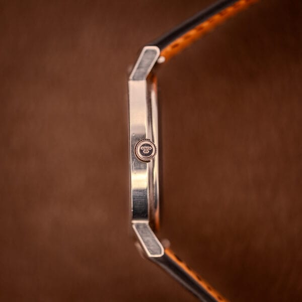 Jaeger LeCoultre Ref. 5003.42 case side profile showing the JL signed crown intact and the slab-thin polished steel case band.
