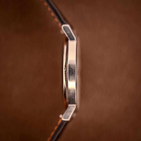 Jaeger LeCoultre Ultra Thin opposite case side, slab-thin steel band, faceted lug tops, no crown visible.