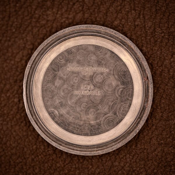 Inner caseback stamped JAEGER LeCOULTRE / SUISSE / ACIER INOXYDABLE across the central guilloché disc on Ref. 5003.42.