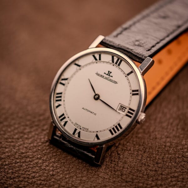 Jaeger LeCoultre Ultra Thin Ref. 5003.42 three-quarter view on brown leather, factory white Roman numeral dial with date at three.