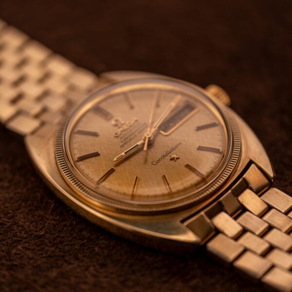 Omega Constellation 168.029 cushion case in 14k gold-capped construction on its original gold-filled rice-link bracelet