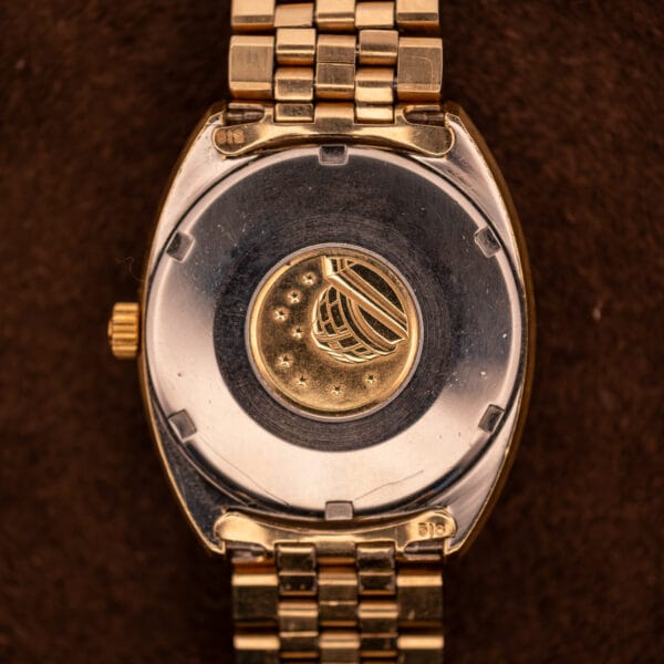 Omega Constellation 168.029 caseback featuring gold-toned observatory medallion with eight stars on stainless steel back