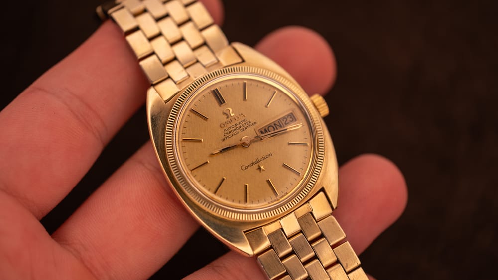 Gold vintage Omega Constellation Day-Date with original champagne dial, an authentic-original example for collecting beginners.