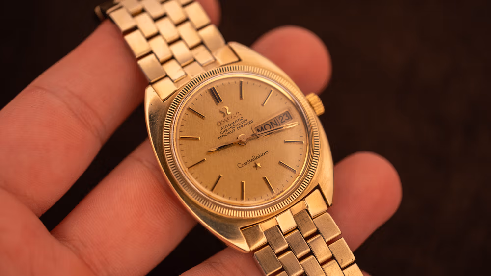 Gold vintage Omega Constellation Day-Date with original champagne dial, an authentic-original example for collecting beginners.