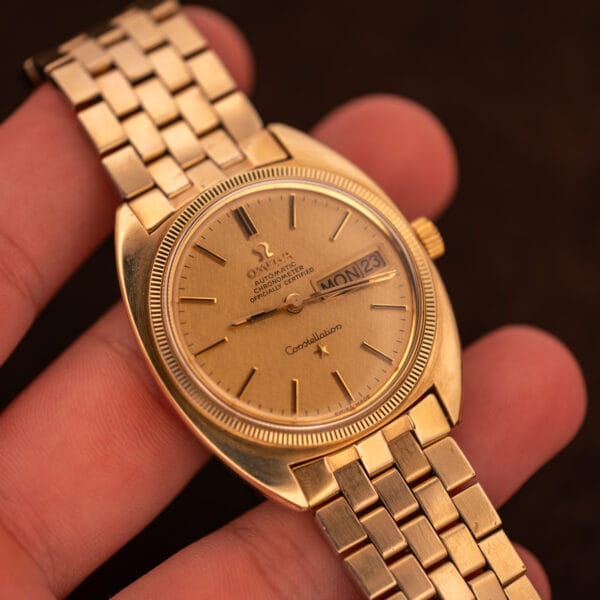 Omega Constellation 168.029 day-date Chronometer in hand showing linen dial, applied indices and signed Omega crown