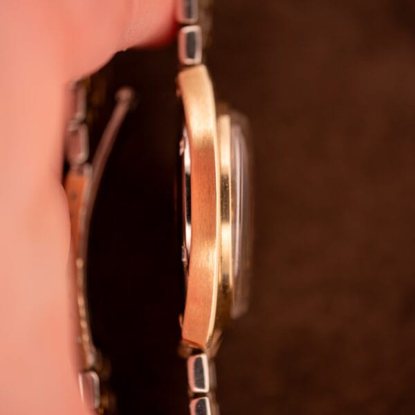 Omega Constellation 168.029 case side profile showing 14k gold cap construction and integrated bracelet endlinks
