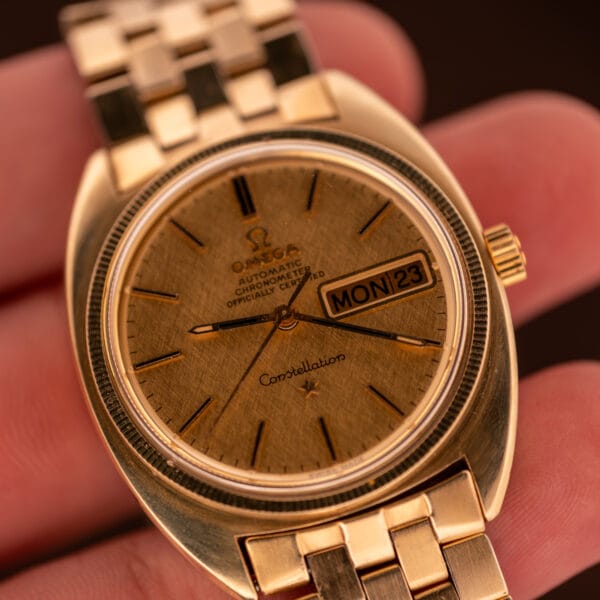 Omega Constellation 168.029 vintage day-date Chronometer linen dial worn in hand for scale