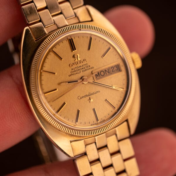 Omega Constellation 168.029 dial macro showing applied baton markers, Constellation script with star and SWISS MADE at six