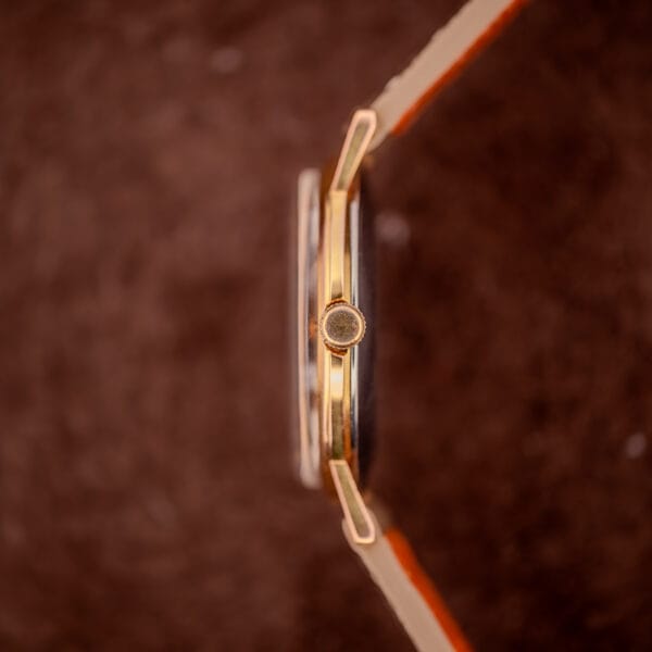 Gruen Precision 510 side profile detail showing knurled gold-plated crown at three and slim case band