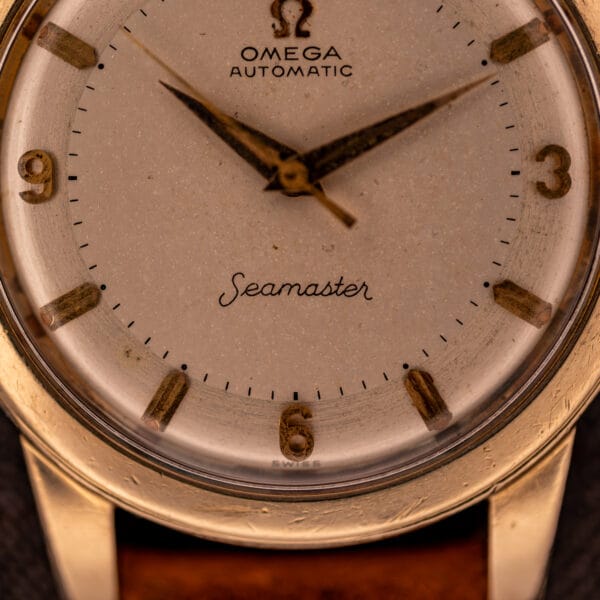 Omega Seamaster GX 6250 dial detail with applied gold 6 and 9 numerals, baton hour markers, and SWISS printed at the base