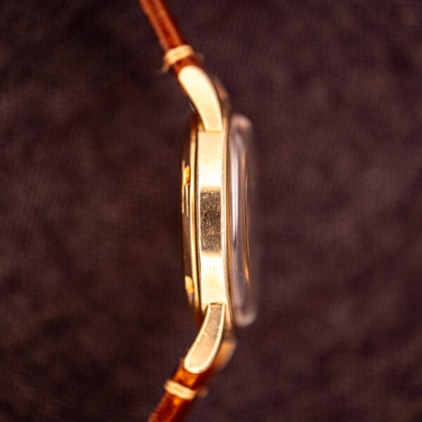 Omega Seamaster GX 6250 opposite case profile showing stepped bezel and polished 14k gold filled case band