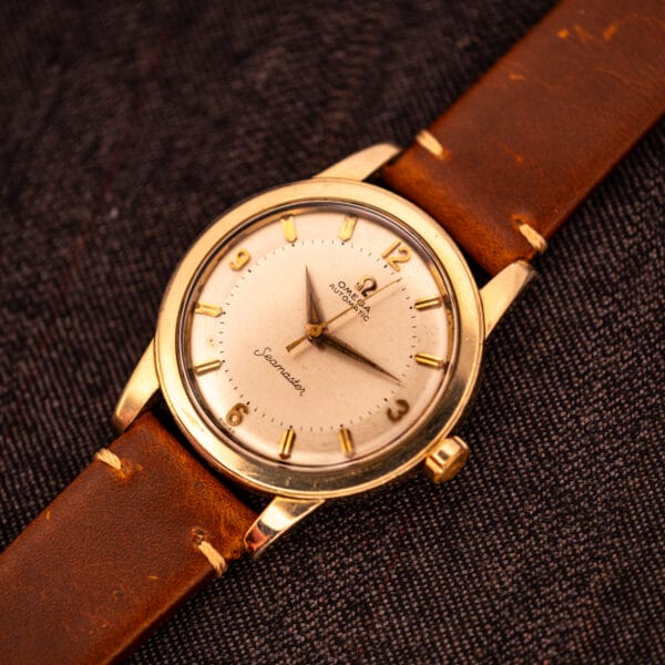 Omega Seamaster GX 6250 overhead angled view showing 34.6mm gold filled case and stepped bezel proportions