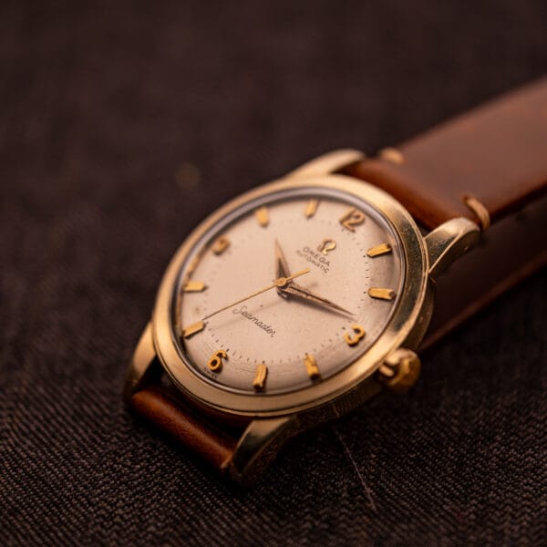 Omega Seamaster GX 6250 angled dial three-quarter showing applied baton markers and Arabic 12, 3, 6, 9 layout