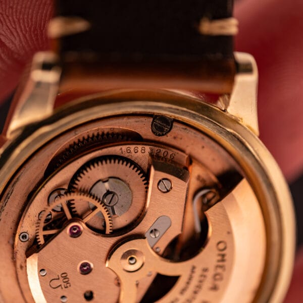 Omega caliber 500 movement detail showing the Ω 500 caliber stamping and serial 16 683 206 on the main bridge