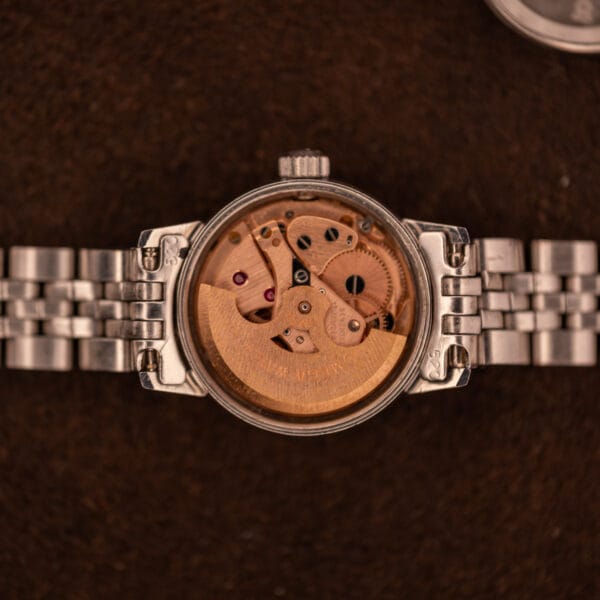 Omega caliber 681 automatic movement inside the Ladymatic 566.002, copper-toned bridges with OMEGA WATCH CO signed rotor