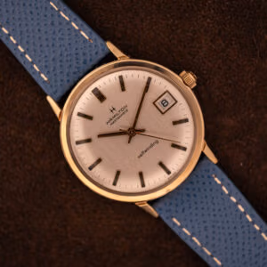 Vintage Hamilton Masterpiece silver sunburst dial top-down with date at three on blue Saffiano leather strap