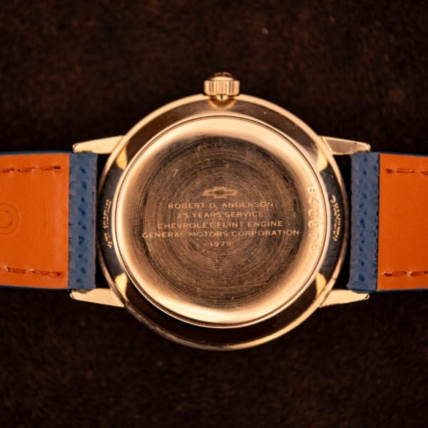 Hamilton Masterpiece automatic photographed top-down on suede showing applied dagger indices and date at three