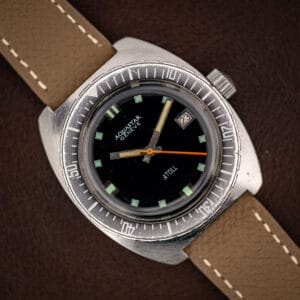 Aquastar Geneve Atoll Ref. 1001 vintage skin diver on mud grey Saffiano leather strap, matte black dial with orange sweep seconds