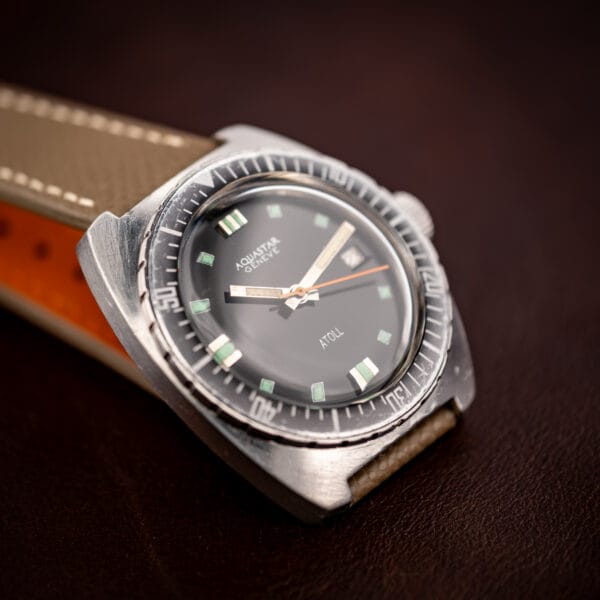 Aquastar Geneve Atoll 1001 close angled view showing dial, bezel patina and lug shape