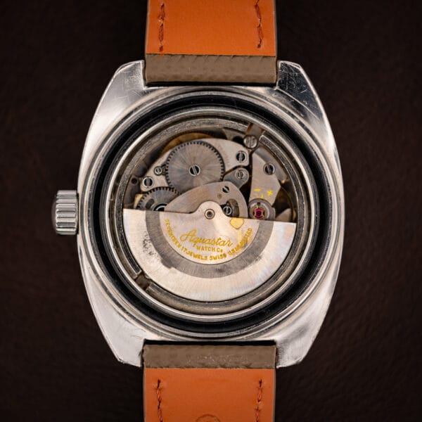 Aquastar Atoll 1001 A. Schild caliber 1903 automatic movement with signed yellow Aquastar rotor visible through caseback