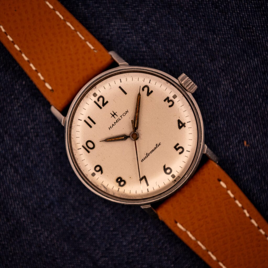 Vintage Hamilton Accumatic A-507 with white textured Arabic numeral dial on tan saffiano leather strap
