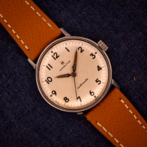 Vintage Hamilton Accumatic A-507 with white textured Arabic numeral dial on tan saffiano leather strap